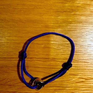 Cartier Triple Gold Trinity Bead on silk cord bracelet